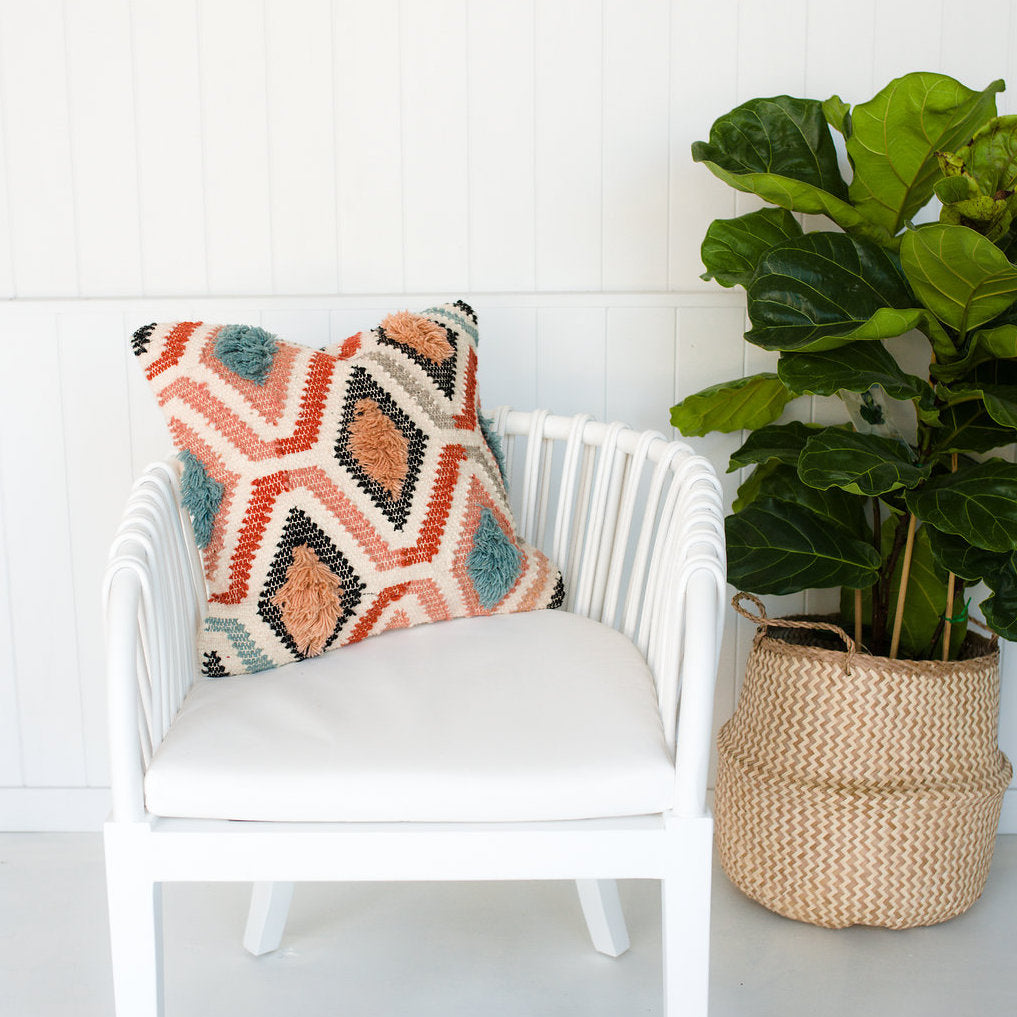 Cushion Pink Sahara styled on a white chair by Oh Happy Home